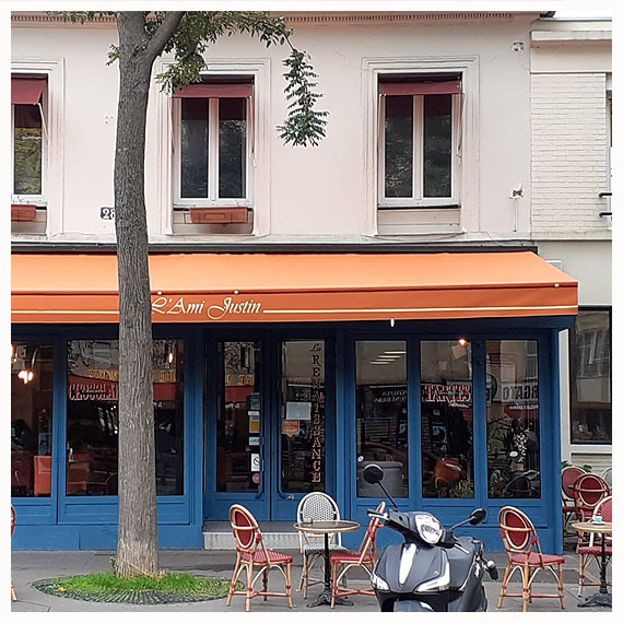 Rentoilage de stores banne de restaurant à Paris - Le Store Parisien